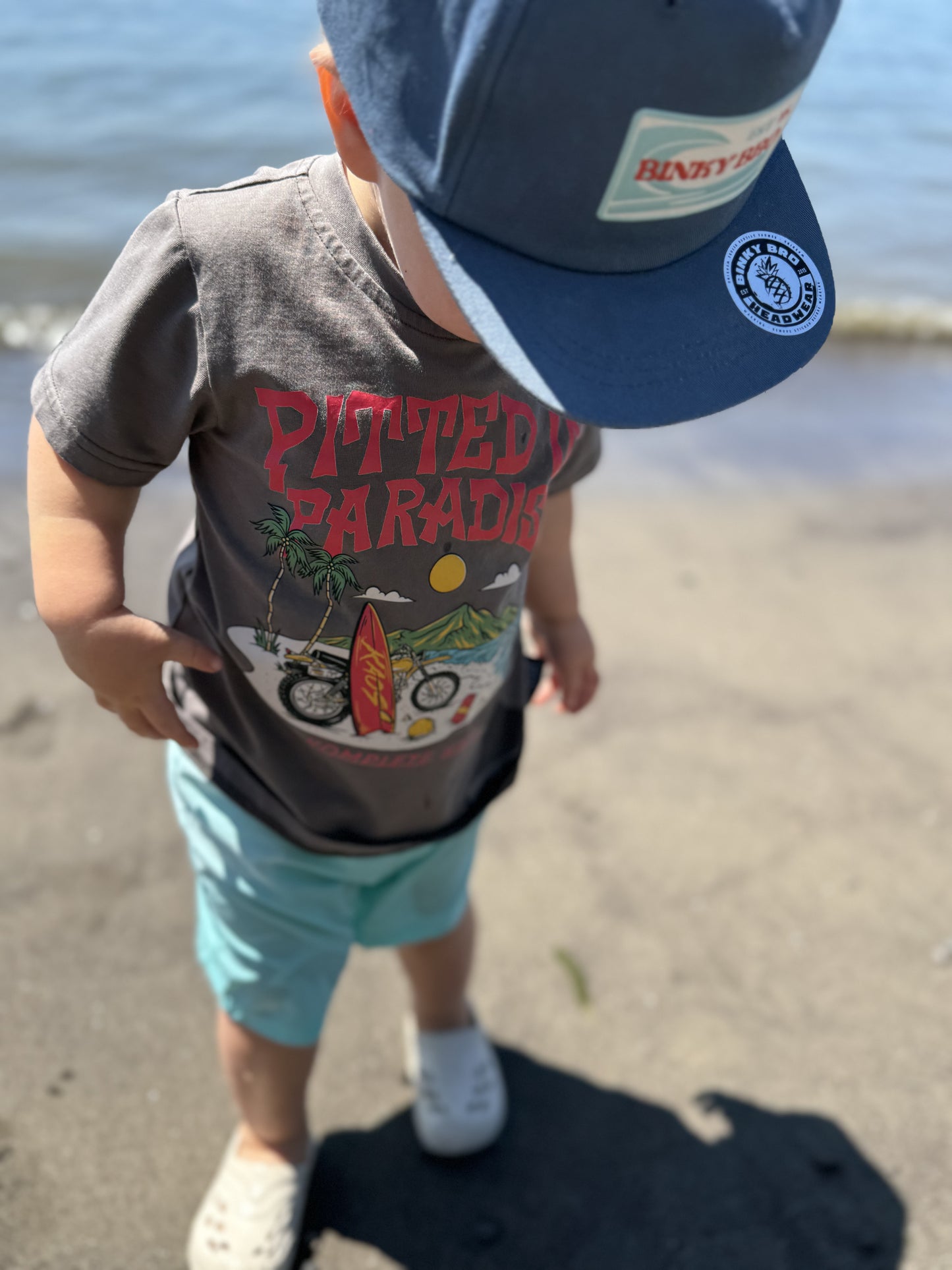 Pitted in Paradise graphic tee